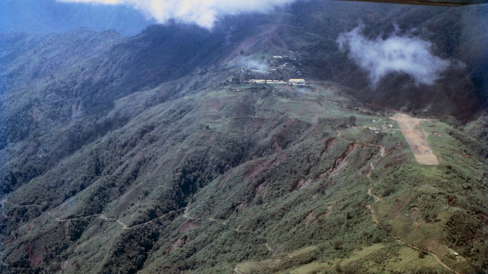 Montane forest ridges above a village airstrip in the Saruwaged Range, Papua New Guinea.