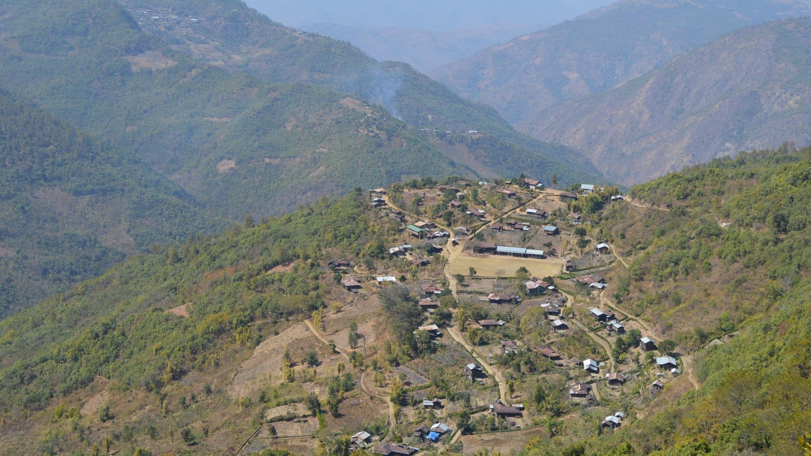A ridge top village with swidden plots among dry hill forest, Chin State, Myanmar.