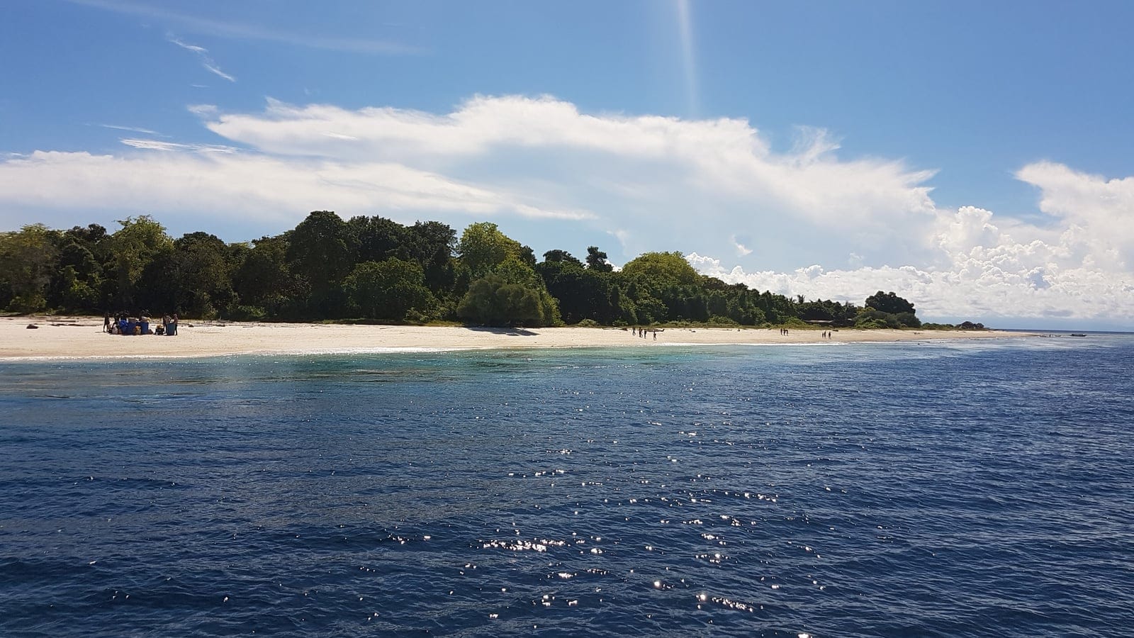 White sand spit and a narrow coastal forest band on Panguan Island, Sulu Archipelago, Philippines.