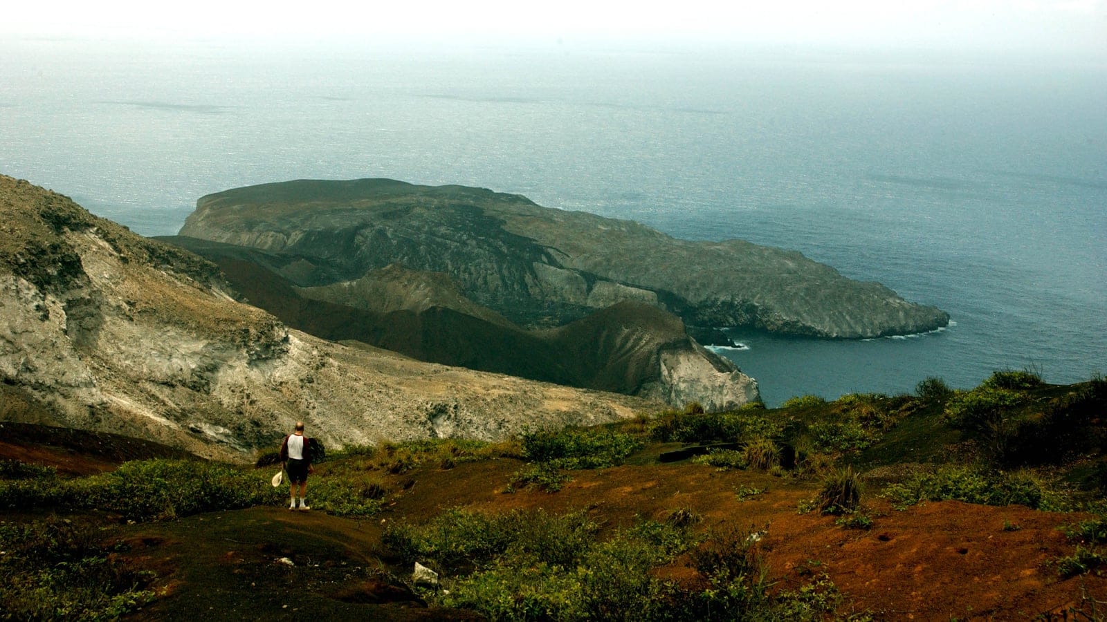 Sparse coastal scrub and volcanic slopes above Southeast Bay on Ascension Island.