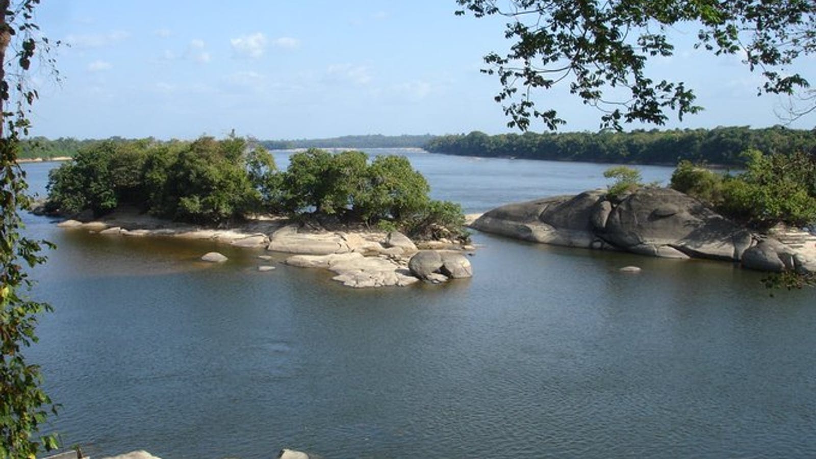 Granite outcrops and forested islets in the Caura River, Bolívar, Venezuela.