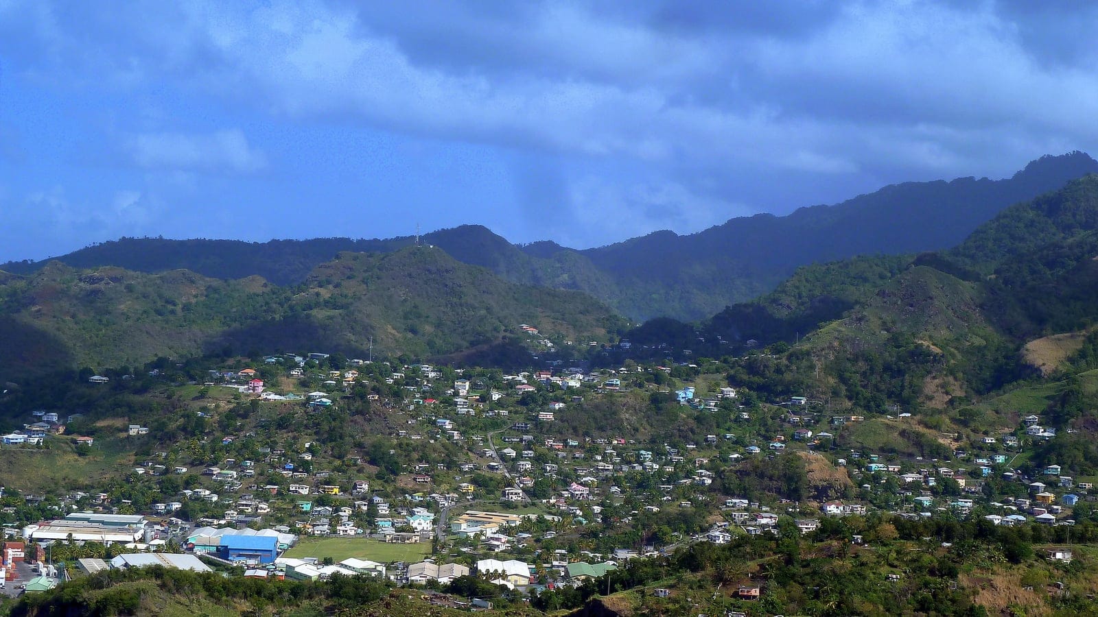 Hillside housing and scrubby green ridges above Kingstown seen from Fort Charlotte, Saint Vincent.