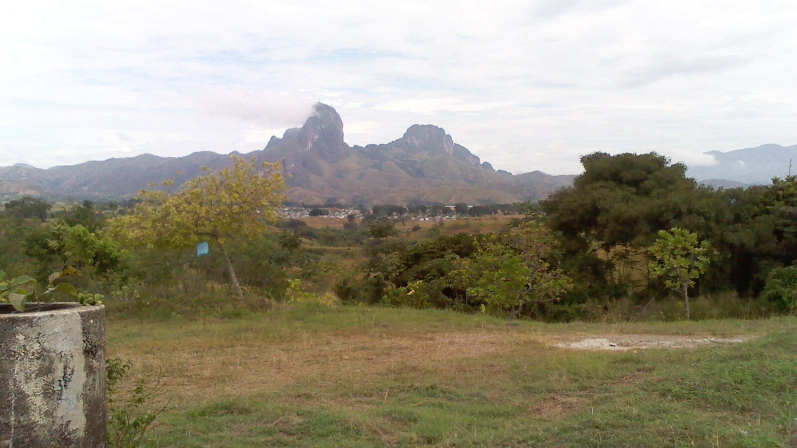 Dry scrub and grass below the twin rock towers of the Morros de San Juan de los Morros, Guarico, Venezuela.