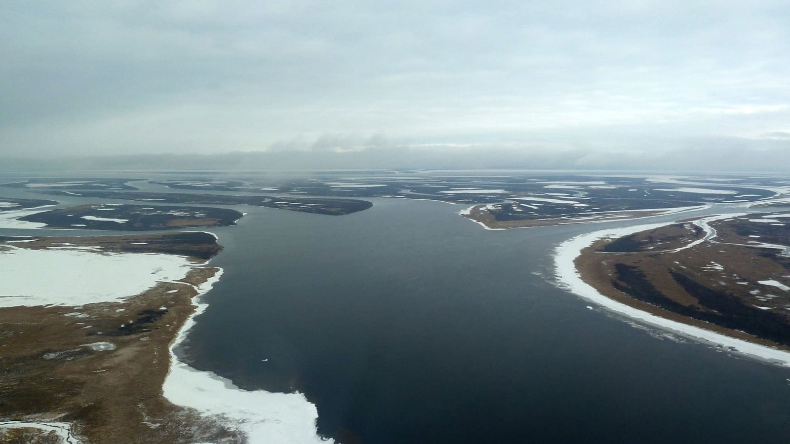 Ice-fringed channels and low tundra islands from the air, Taz River, northern Siberia.