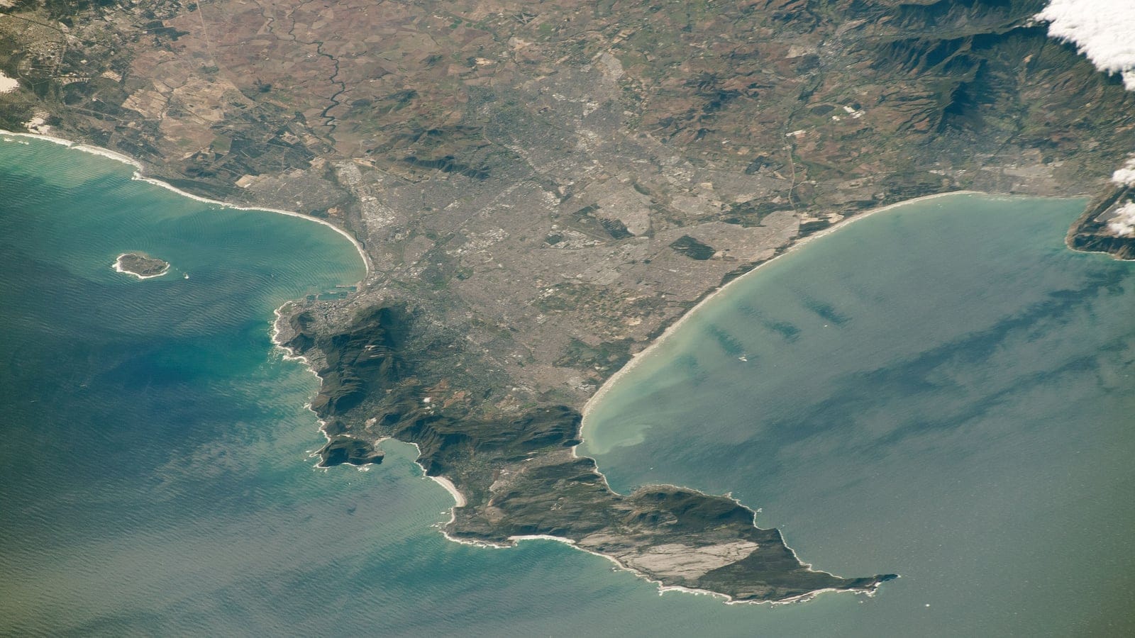Orbital view of the Cape Peninsula and the built up Cape Flats between two bays, South Africa.
